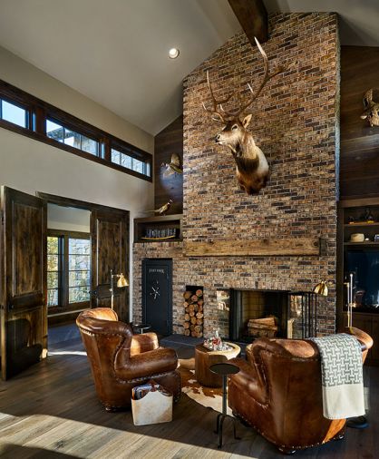 The husband’s love of rustic mountain living is epitomized in his office, located off the more feminine master suite. Roughly hewn mortar distinguishes the fireplace with brick turned to its rough side to emulate a 1920s saloon. Artisan mantels by Arrow Frame Timber.