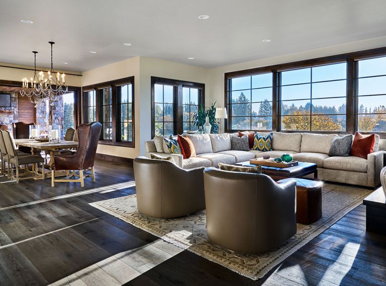 The hearth room is the central hub for the family during the week, with its fireplace for coziness, TV for relaxing, and sofas for lounging as meals are prepped nearby.