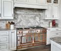 Provenza flooring, an engineered prefinished European oak stands up to heavy traffic, while a top-of-the-line La Cornue range from Eastbank Conractor Applinaces, makes cooking a visual and task-oriented delight. Herringbone marble backsplash.