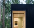 The master bathroom, viewed from the exterior. A gravel bed outside the window uses river rock similar in color to the interior concrete floor to underscore the inside-outside connection. “It just extends your eye to the exterior,” says Joseph.