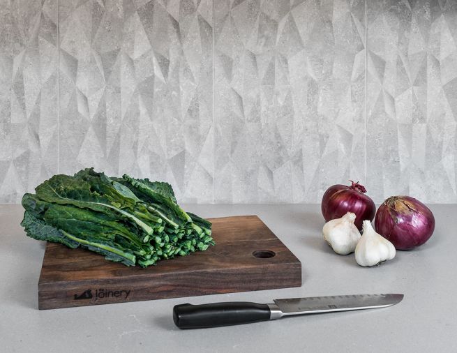 Ceramic backsplash tiles add a naturalistic texture without the porosity of stone, which can be hard to clean.