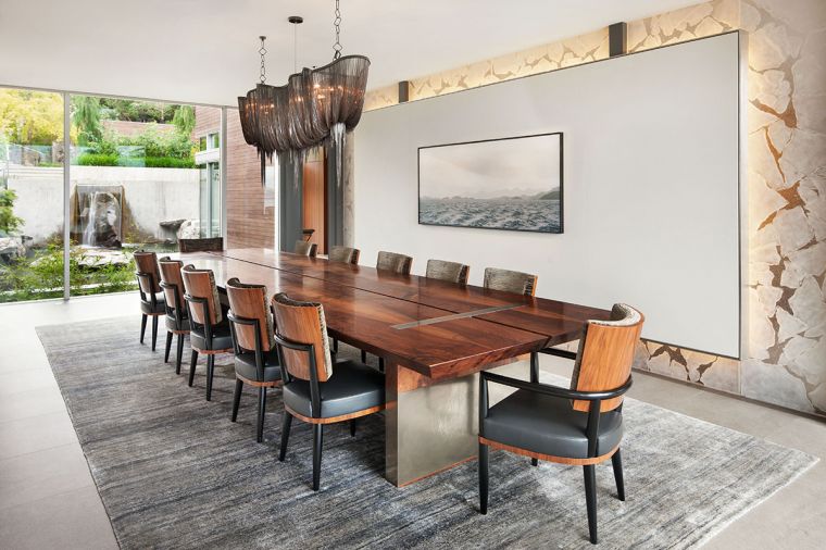 Atlantis blackened nickel jewelry chainmail chandelier by Terzani crowns the GCW custom walnut dining table and chairs with nickel accents. GCW floating fused glass wall dampens noise during large dinner parties.