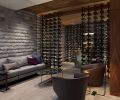 Individual LED lights illuminate each bottle of wine. “The negative space between bottles was an important way to display the client’s best wines,” says Garret.