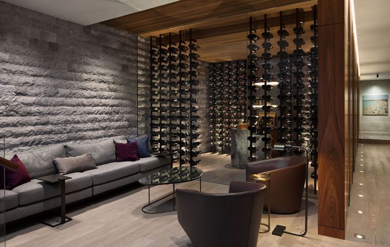 Individual LED lights illuminate each bottle of wine. “The negative space between bottles was an important way to display the client’s best wines,” says Garret.