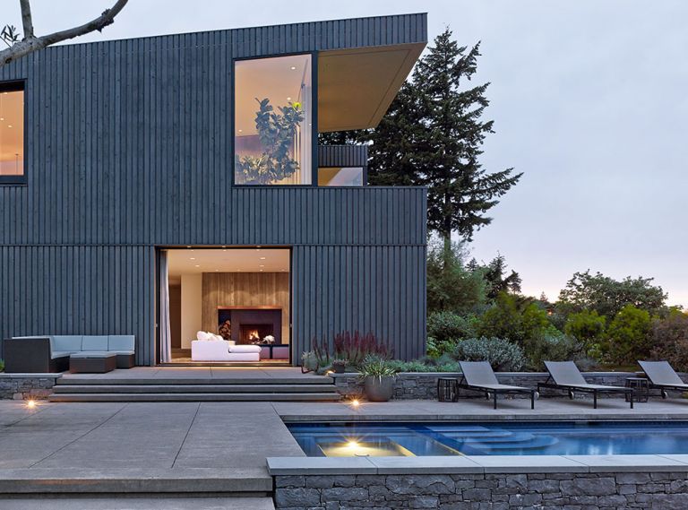 The board and batten exterior creates an intentional architectural detail &ndash; a shadow line that looks as if one plane is floating in front of the other, since the return of the batten is unseen. An Ebony and Cape Cod gray stain by Sikkens products adds definition.
Photography &copy; Jeremy Bittermann