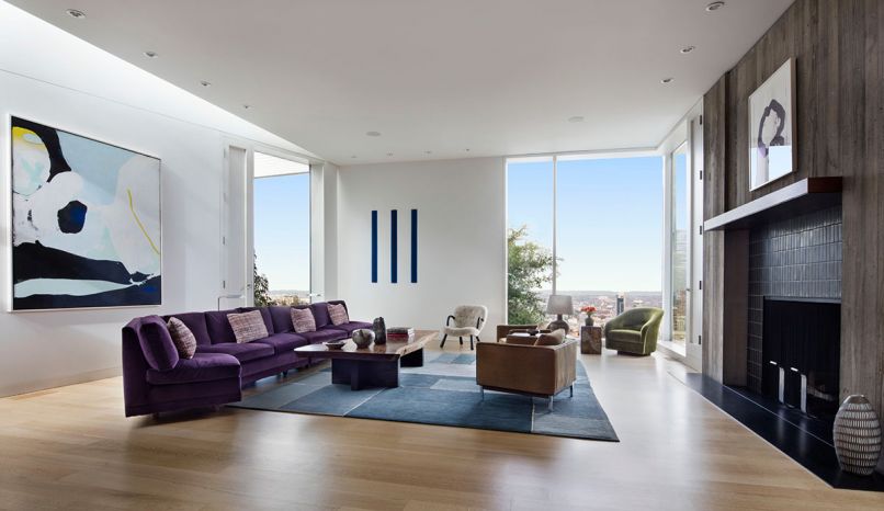 The striped Peter Alexander wall art left plays off the piano’s keys right. A purple Tommy Parzinger sectional sofa is upholstered in 1950s Maharam sofa fabric. It is cocked at one end to replicate the geometry of the wedge of light that filters into the room. The popular 1944 “Clam” Chair by Philip Arctander was sourced through a Swedish auction house. Mallet, a Portland furniture manufacturer, built Frazar’s custom coffee table using a Costa Rican wood slab with mahogany legs. Frazar designed the custom block rug by Beauvais Carpets. Ward Bennet’s 1970s Swivel chairs were found on 1st Dibs. Vintage lamp by Tue Paulsen. Integrated audio and video throughout the home by E Cubed Audio VIdeo.
Photography © Udom Surangsophon