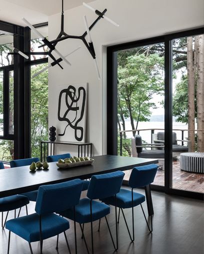 An open layout that emphasizes spaciousness and flow may have accomplished the impossible—getting guests to hang out someplace other than the kitchen. “We had a party recently, and I looked up and noticed instead of everybody hanging out in the kitchen, there were people using the front deck, the back deck, the dining room, and the living room,” says the homeowner, who then laughs. “And of course, they were in the kitchen too.”