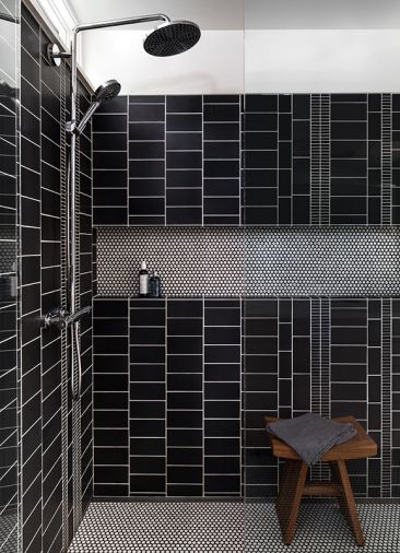 In the master bath shower, one of the homeowners used her graphic design skills to create a custom tile layout using simple charcoal glaze ceramic tile. “I wanted something that wasn’t overly symmetrical and that had a good sense of movement to it,” says the homeowner. “It’s fun that I was able to put my stamp on something.”