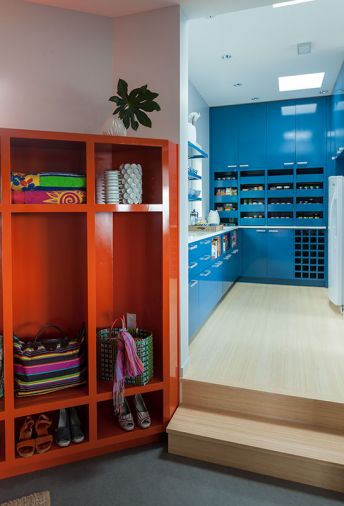 A mud room and butler’s pantry are located at the home’s entrance from the garage, forming a durable “back-of-house” zone.