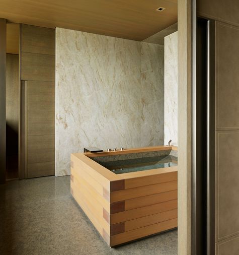 Hunziker custom closet door with metal pull echoes wooden Japanese soaking tub.