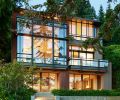 Baba changed entire face of the former home to open toward views. Obscured by tree limb left is master bathroom with green planted roof.