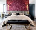Kyle Bunting pink cowhide wallcovering crowns gray channel back Restoration Hardware headboard and HBB Studio nightstands. Black cowhide and brass bench by Worlds Away. Mombasa Rug by Feizy Rugs.