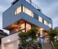 A super-steep, relatively small site brought challenges, but also opportunity. Instead of building out, this home went up to fit just over 3,000 square feet on a city lot. Terraced walkways, patios, and staircases knit the home into the landscape, and the offset cantilevered form creates plenty of opportunities for rooftop outdoor space.