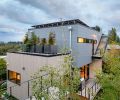 Rooftop planters are filled with dwarf conifers that evoke an alpine forest.