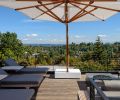 The rooftop patio features a built-in firepit and views of the Cascades and Puget Sound.