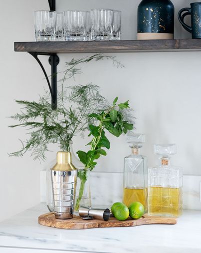 Half-inch thick marble splash is “set on” top of the countertop, fabricated by de la tierra, inc.