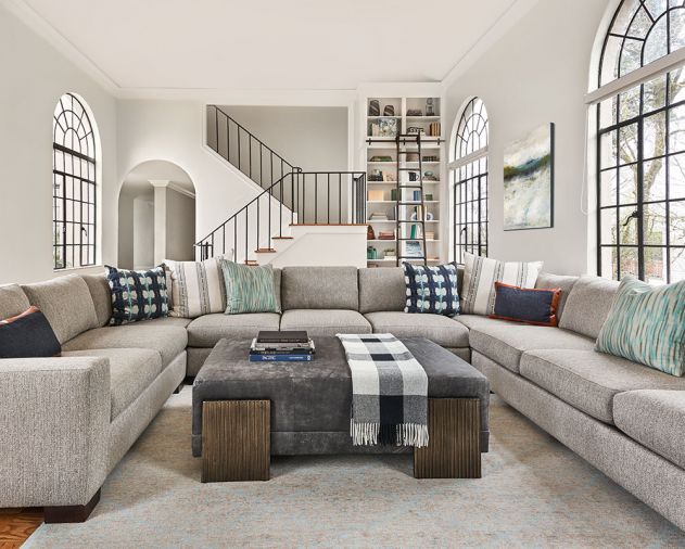 Once a games room, the family room features a built-in library and 10' ladder that echoes intact turned steel staircase railing.