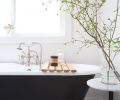 In the master bath, Justine Lyon’s “sanctuary,” a vintage-style black tub with opulent silver feet sits upon carrara marble flooring done in a small hex pattern, which continues in a larger format in the freestanding shower.