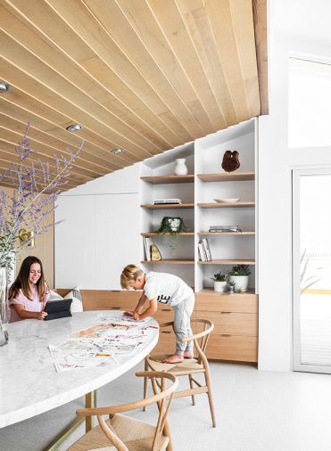 A built-in dining nook doubles as a craft and homework area for the homeowners’ kids.