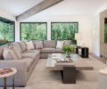 Adding to the neutral-but-comfortable vibe, the formal living room’s sectional and lounge chair are from A. Rudin, with fabric by Holly Hunt, coffee table by LUMA, side tables from Restoration Hardware and Elan Atelier, and rug from Stacey Logan.