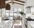 A modern palette of white, black, and gray pervades this farmhouse-style renovation, enhanced by brushed brass accents and fixtures in both the carriage and main house kitchens, which include cabinet design by Signature Design & Cabinetry. The water view is paramount from the kitchen and dining room, where a mix of the client’s own furniture and vintage pieces tie in with the marble countertops and wood accents. Windows by Sierra Pacific.