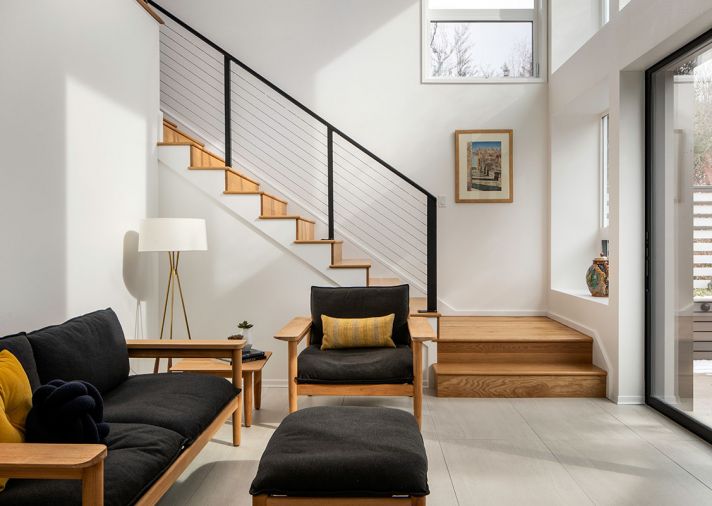 The entry’s large-scale Stone Box tile from Pental Surfaces creates a subtle tonal shift between the wood plank flooring on the rest of the main level.