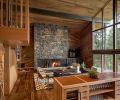 Energy efficiency and quality systems were a priority for the client, along with using quality and natural local materials appropriate for the Black Butte location. Montana Moss stone, for example, is found in abundance, including behind the great room’s striking Ponderosa Forge fireplace. Clad in fir and cedar, the room’s ceiling lines mimics the exterior roof slope, as do those in the rest of the home, creating an elevated wood lodge vibe and enhancing the distinct indoor-outdoor connection.