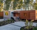 Spaced vertical mahogany boards create a screen framing metal clad wood Sierra Pacific windows.