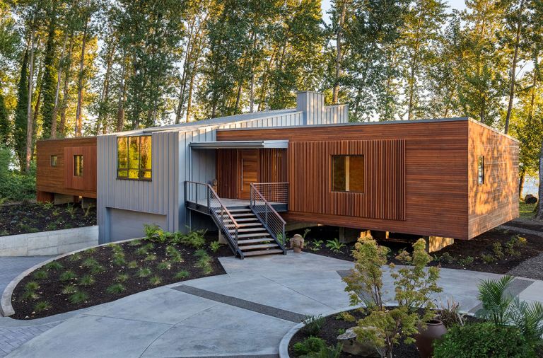 Spaced vertical mahogany boards create a screen framing metal clad wood Sierra Pacific windows.