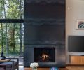 Miller glued hot-rolled steel plates to plywood to form the fireplace.