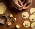 McKee forms Cappelletti pasta (little hats) by hand.