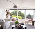 The temptation was to face the sofa towards the view, but a more oblique arrangement makes the living room more inviting for gathering while still letting loungers take in the vista.