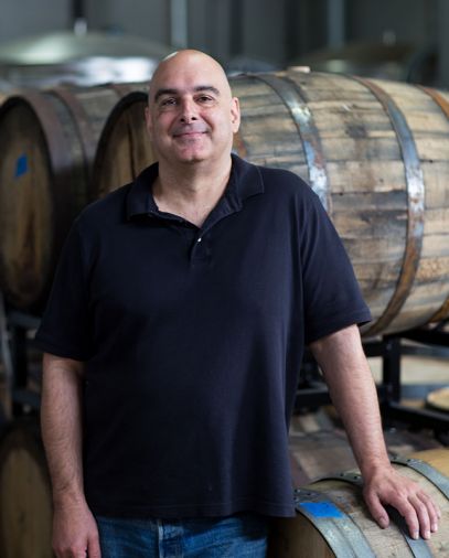 Lee Madoff, founder and owner of Bull Run Distillery, poses at his Northwest Portland barrel house and tasting room. A second Bull Run tasting room opened in Carlton, Oregon, in 2018.