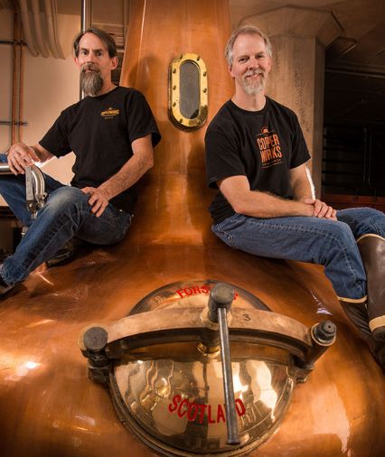 Copperworks Distilling co-founders Jason Parker and Micah Nutt celebrate their recognition as 2018 Distillery of the Year by the American Craft Spirits Association.