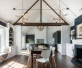 A typical 1940s interior—think lots of small, defined spaces separated by doorways and walls—made the kitchen and dining areas feel cramped. By removing interior walls and raising the ceiling to the roofline, this project transformed a historic home into a light, bright, airy space. Yet by keeping the original built-ins and echoing traditional design elements like crown molding and lapboard in other areas of the home, the remodel stayed true to the underlying structure.