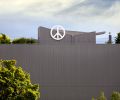 Extending a holiday tradition from their previous home to year-round adornment, the homeowners hired a sign company to create and install the Peace sign on their unit.