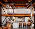 A view of both floors, includes Wolf range and Moda Vetro Airstrip backsplash. Bar at left was reconfigured with cabinets for storage installed beneath.