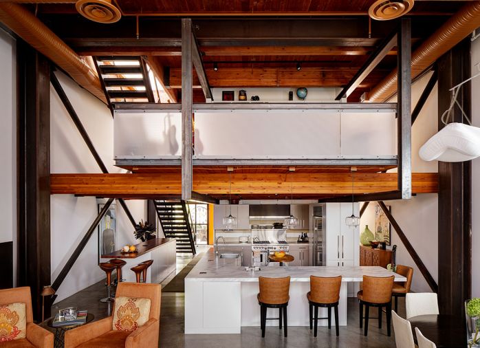 A view of both floors, includes Wolf range and Moda Vetro Airstrip backsplash. Bar at left was reconfigured with cabinets for storage installed beneath.