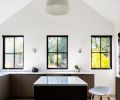 Johnson designed Artiss’s ceramic workshop with easy-to-clean concrete floors. An oversized Fritz Hansen Caravaggio pendant hangs over the central worktable.