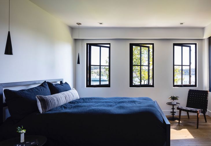 Upstairs daughter’s bedroom features Room&Board Parson’ bed in natural steel tied to slim-lined black pendants from Seattle Lighting.