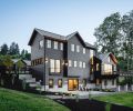 Three-story 3,625 sq. ft. contemporary farmhouse oriented toward harbor view. Artist workshop at right, daylight basement below.