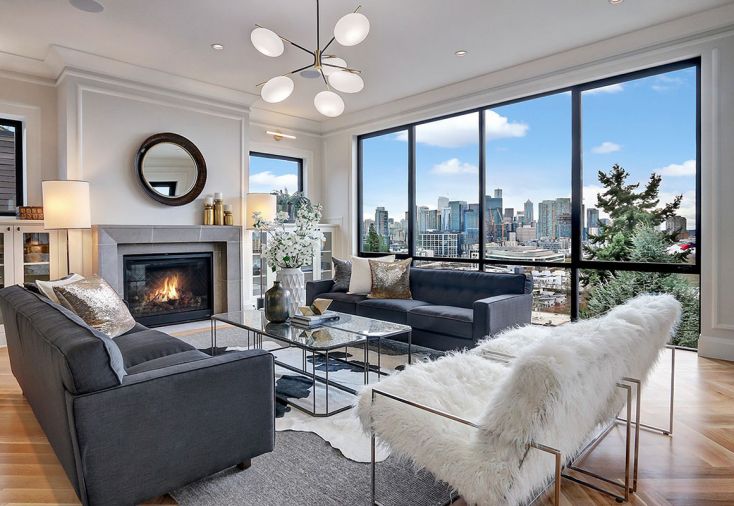 RD Interiors fashioned the home’s interior furnishings. West Elm Champignon chandelier adds modernism to traditional fireplace and cabinetry.