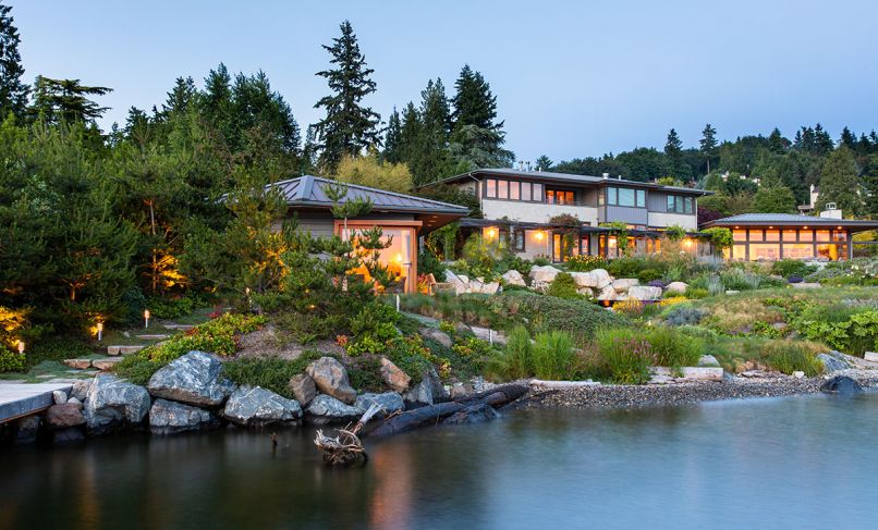 The once sterile lawn-centric landscape of this Lake Washington home now boasts a magnificently terraced, environmentally and wildlife friendly landscape by Paul Broadhurst replete with newly-designed guest house left, and an infinity pool - all of which slopes gently down to the water’s edge with meandering paths and a pebble beach secured by logs and boulders handpicked from a quarry in the Cascades. The landscape design became a pilot project for Green Shores for Homes, an EPA-funded initiative to promote healthy soft shorelines.