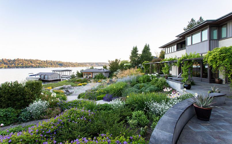 The residence now perches above the terraced garden laid out with geometric features ala Kandisky’s Composition 8, including the circular recessed terrace with firepit abutting the Fescue Meadow and Log Bench Lookout. Broadhurst relocated the guest house in the distance pocket glass walls that open to garden. Easy-to-clean Pennsylvania Bluestone floors that flow outdoors help guesthouse double as pool house.