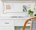 In the kitchen, recipes and lists can be reviewed at the built in desk. A Parisian chair echoes its stool brethren at the island.