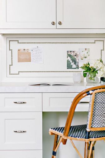 In the kitchen, recipes and lists can be reviewed at the built in desk. A Parisian chair echoes its stool brethren at the island.