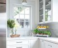 Drawers of various depths and a corner cabinet with a swing out interior provide essential and flexible storage in the kitchen.