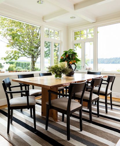 Live-edge Urban Hardwoods dining table. Perennials high performance rug from Susan Mills showroom.