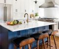 Venetian Stone Works installed the Pental quartz island countertop. The eye-catching island beadboard cabinetry features Sherman Williams Mount Etna paint for visual contrast. White subway tile backsplash wraps around a pair of Milgard Tuscany windows flanking the Fisher Peykel range. Article barstools are comfortable and easy-to-clean even with kids. Eakman Construction worked closely with Prince and Lindman to successfully deliver Beth’s vision. Delta Trinisic Champagne bronze fixtures. Black hardware echoes Craftsman style pendants by Restoration Hardware.