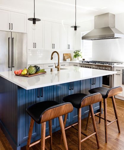 Venetian Stone Works installed the Pental quartz island countertop. The eye-catching island beadboard cabinetry features Sherman Williams Mount Etna paint for visual contrast. White subway tile backsplash wraps around a pair of Milgard Tuscany windows flanking the Fisher Peykel range. Article barstools are comfortable and easy-to-clean even with kids. Eakman Construction worked closely with Prince and Lindman to successfully deliver Beth’s vision. Delta Trinisic Champagne bronze fixtures. Black hardware echoes Craftsman style pendants by Restoration Hardware.